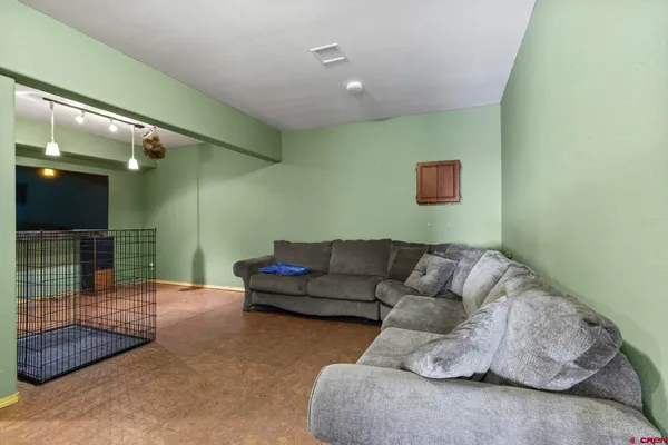a living room with furniture and a rug