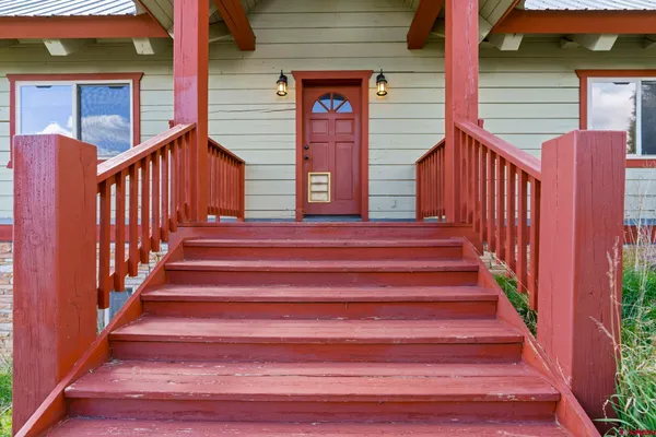 a view of entryway with wooden stairs
