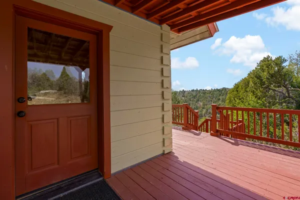 a view of balcony with furniture