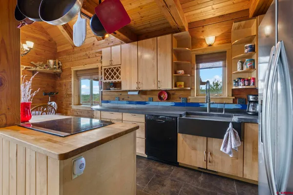 a kitchen with a sink and cabinets