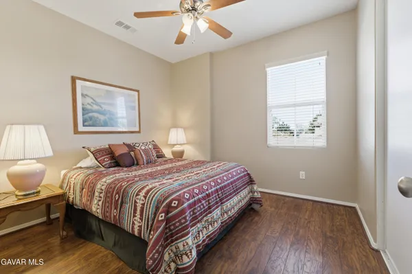 a bedroom with bed and a window