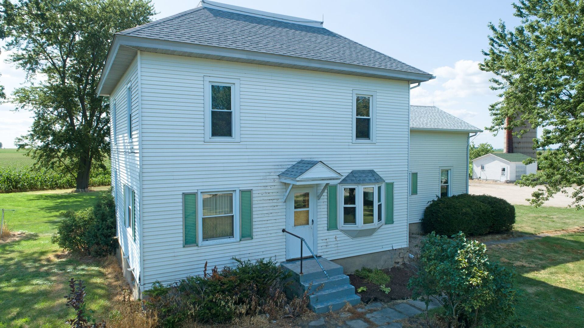 a front view of a house with garden