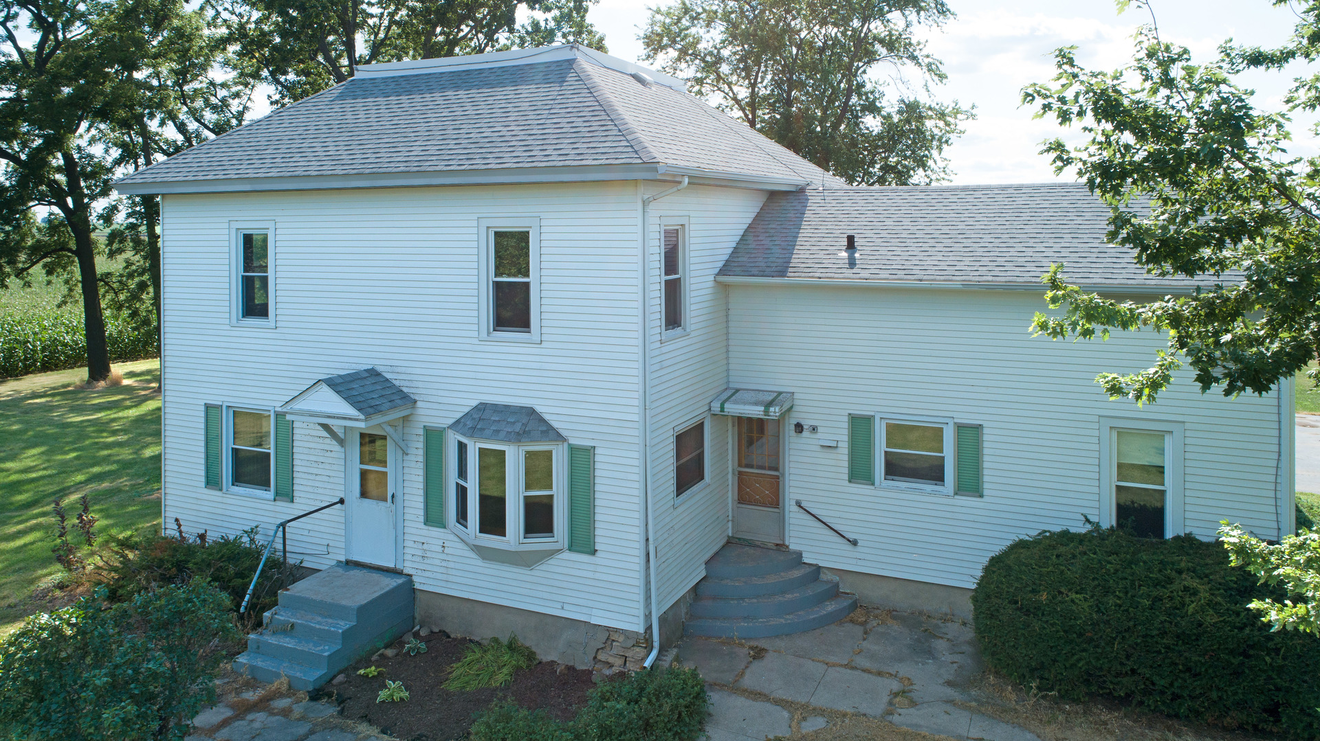 10909 Payne Road Marengo, IL 60152 - Photo 2 of 44 a front view of a house with a garden