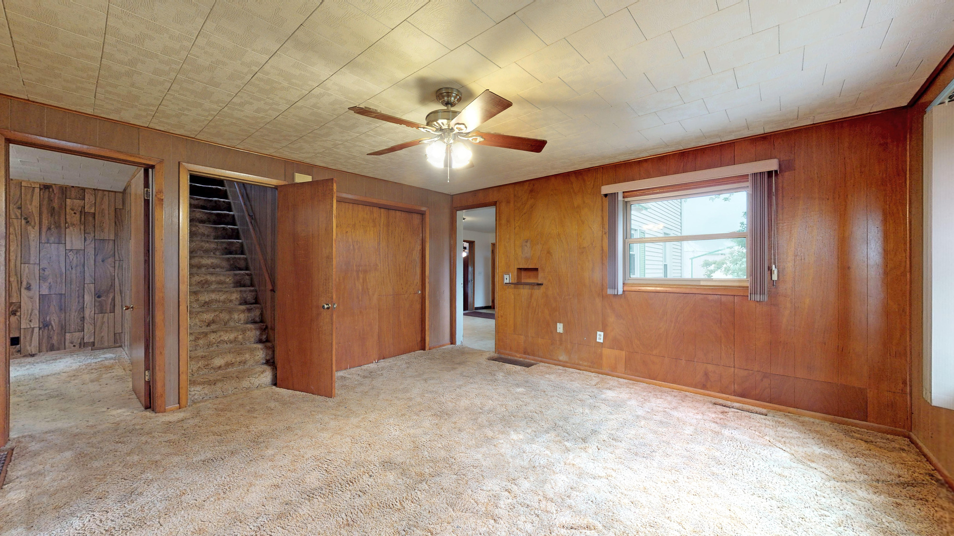 10909 Payne Road Marengo, IL 60152 - Photo 12 of 44 an empty room with closet and a ceiling fan