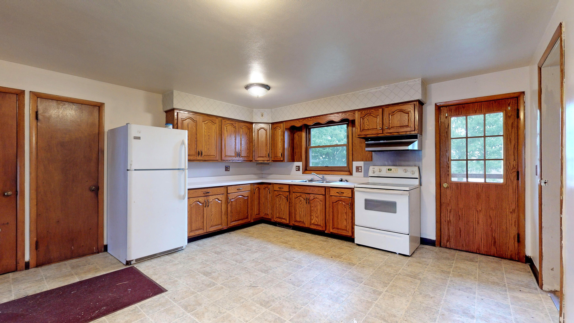 10909 Payne Road Marengo, IL 60152 - Photo 13 of 44 a kitchen with a refrigerator and a stove