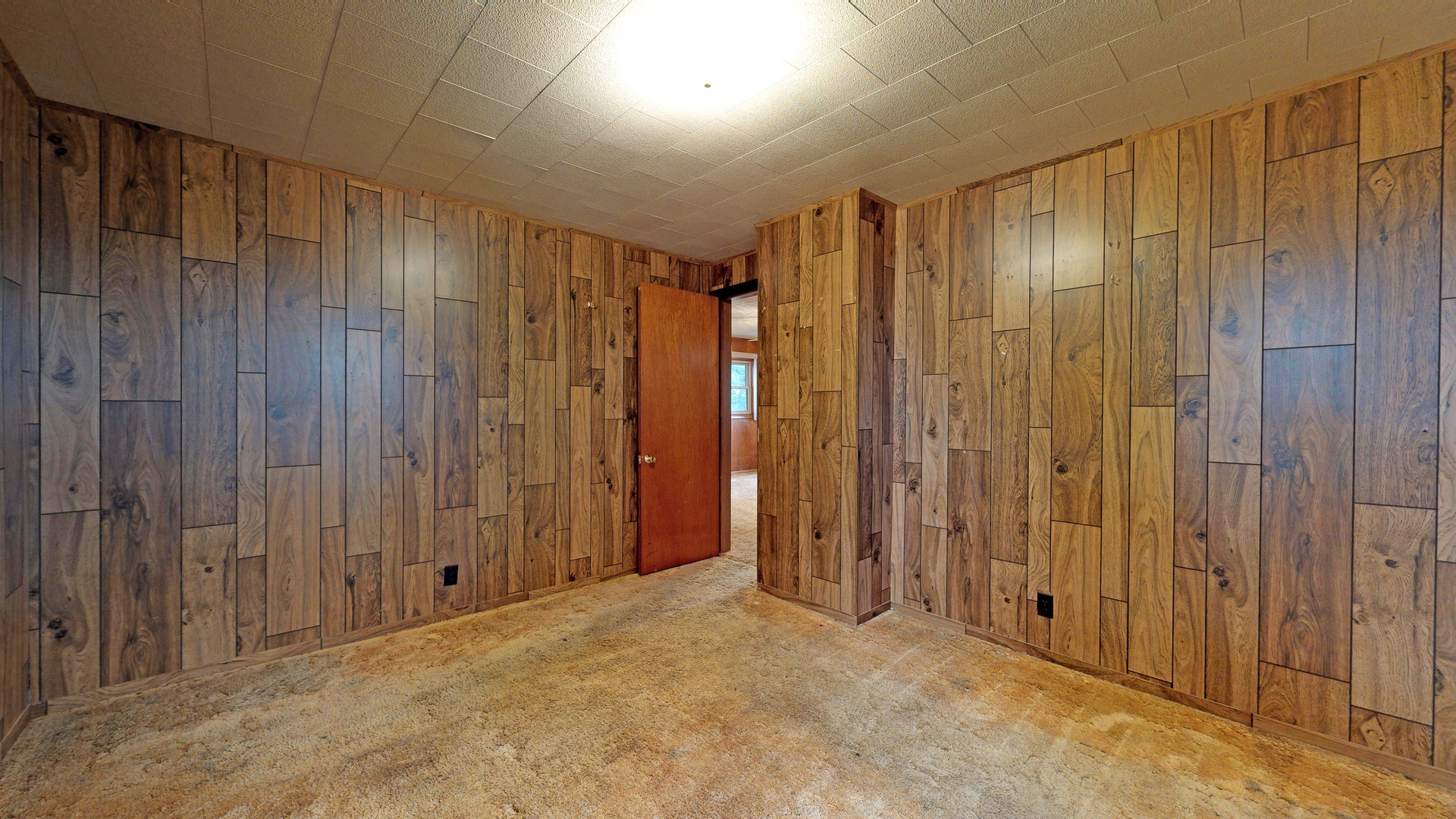 10909 Payne Road Marengo, IL 60152 - Photo 18 of 44 a view of an empty room with wooden walls
