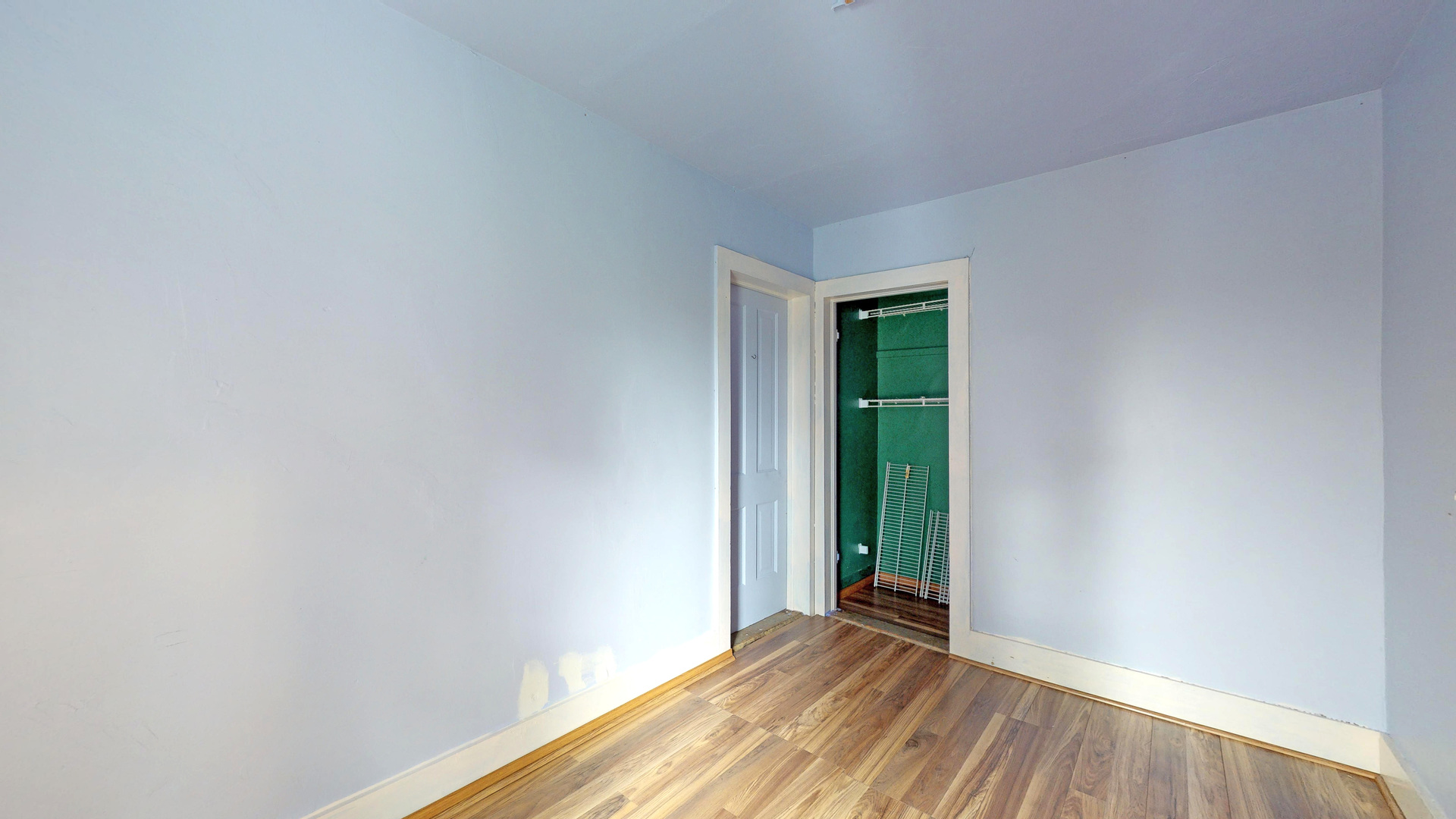 10909 Payne Road Marengo, IL 60152 - Photo 19 of 44 a view of an empty room with wooden floor and a window