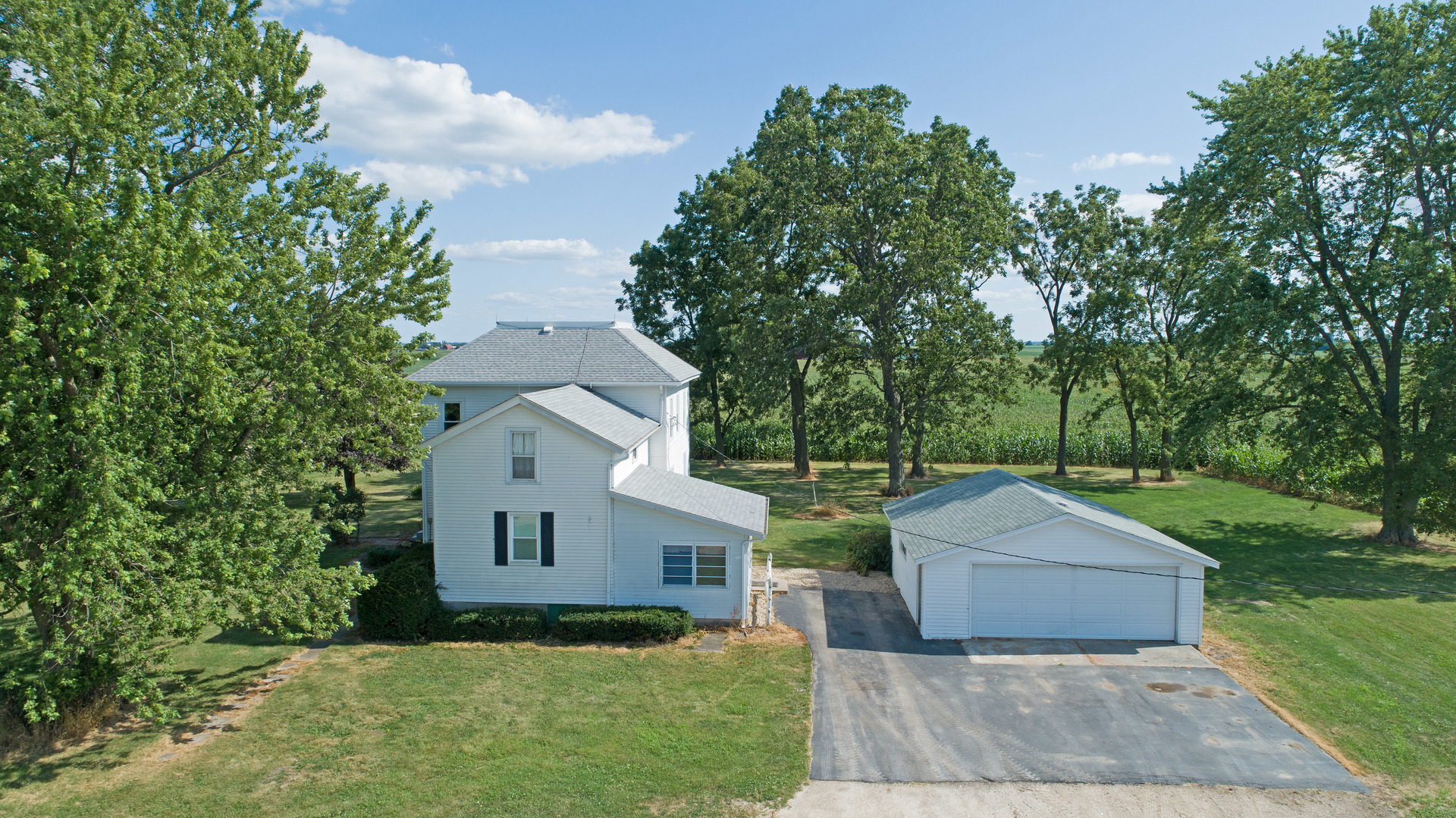 10909 Payne Road Marengo, IL 60152 - Photo 37 of 44 a front view of a house with a garden