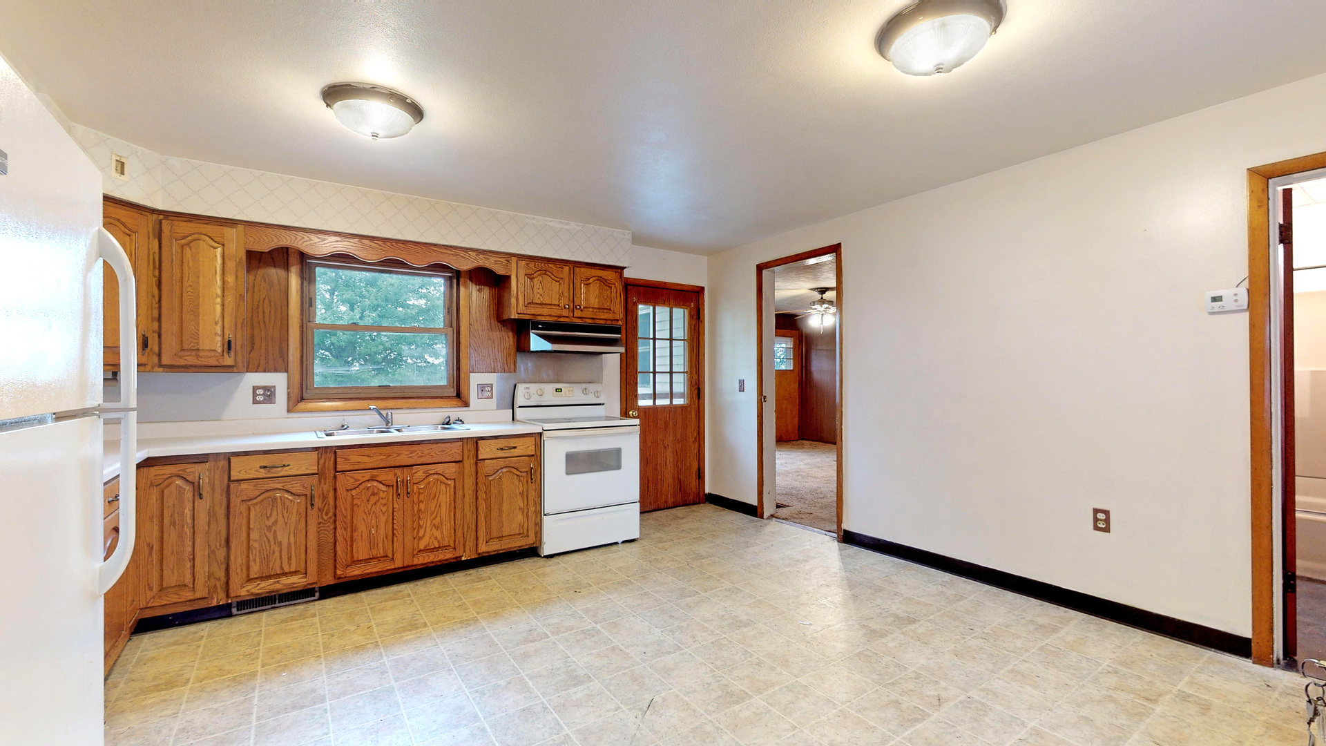 10909 Payne Road Marengo, IL 60152 - Photo 5 of 44 a large kitchen with stainless steel appliances granite countertop a refrigerator and a sink