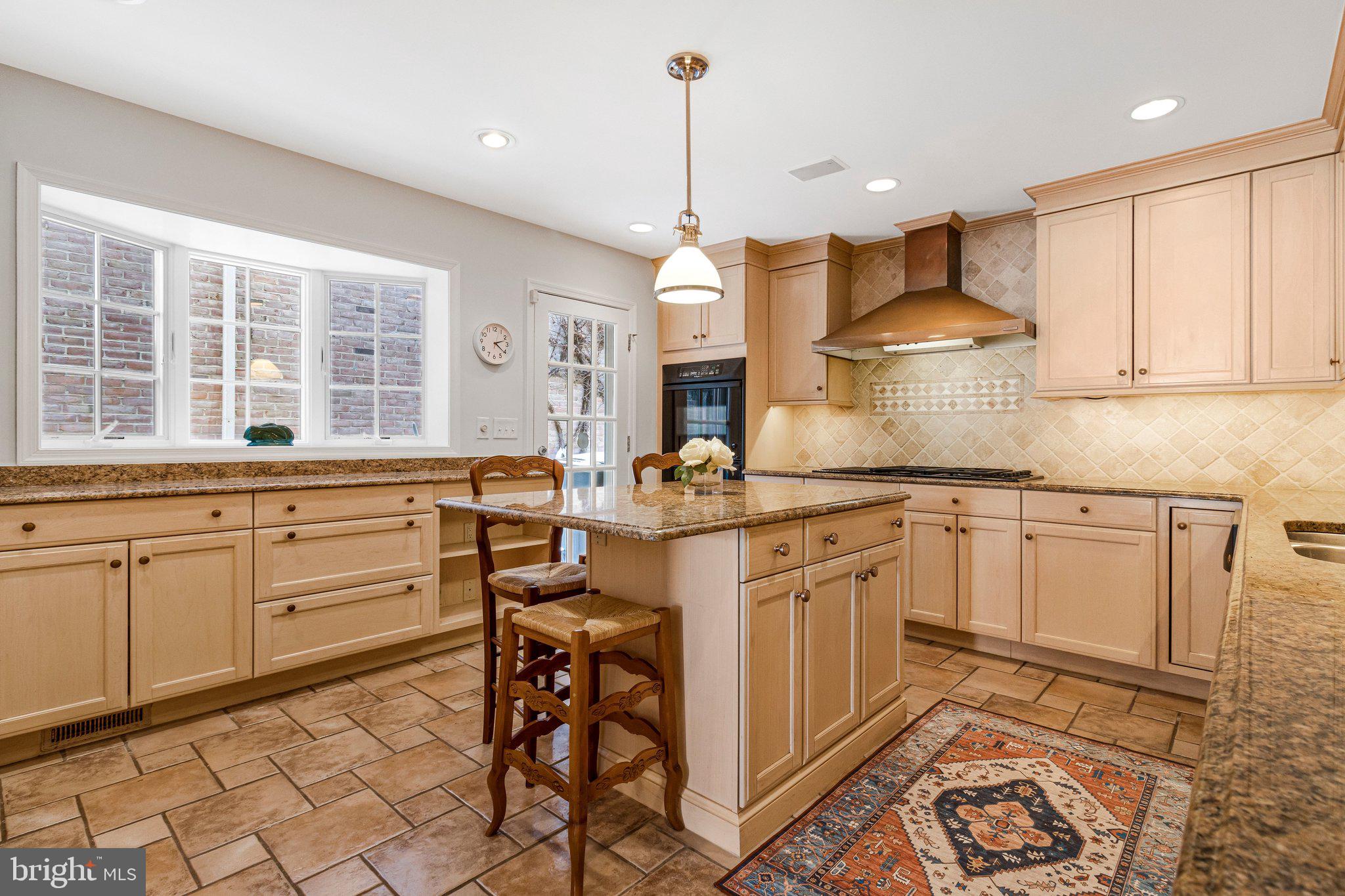 4512 Tournay Road Bethesda, MD 20816 - Photo 11 of 49 Island kitchen with bay window & door to side yard