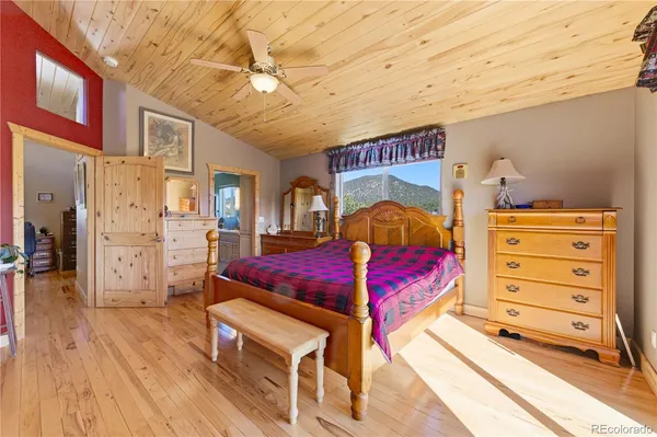 a bedroom with a bed and a cabinets