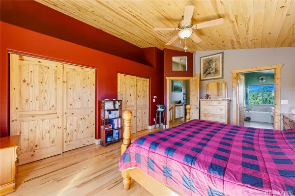 a bed room with a bed and a large dresser
