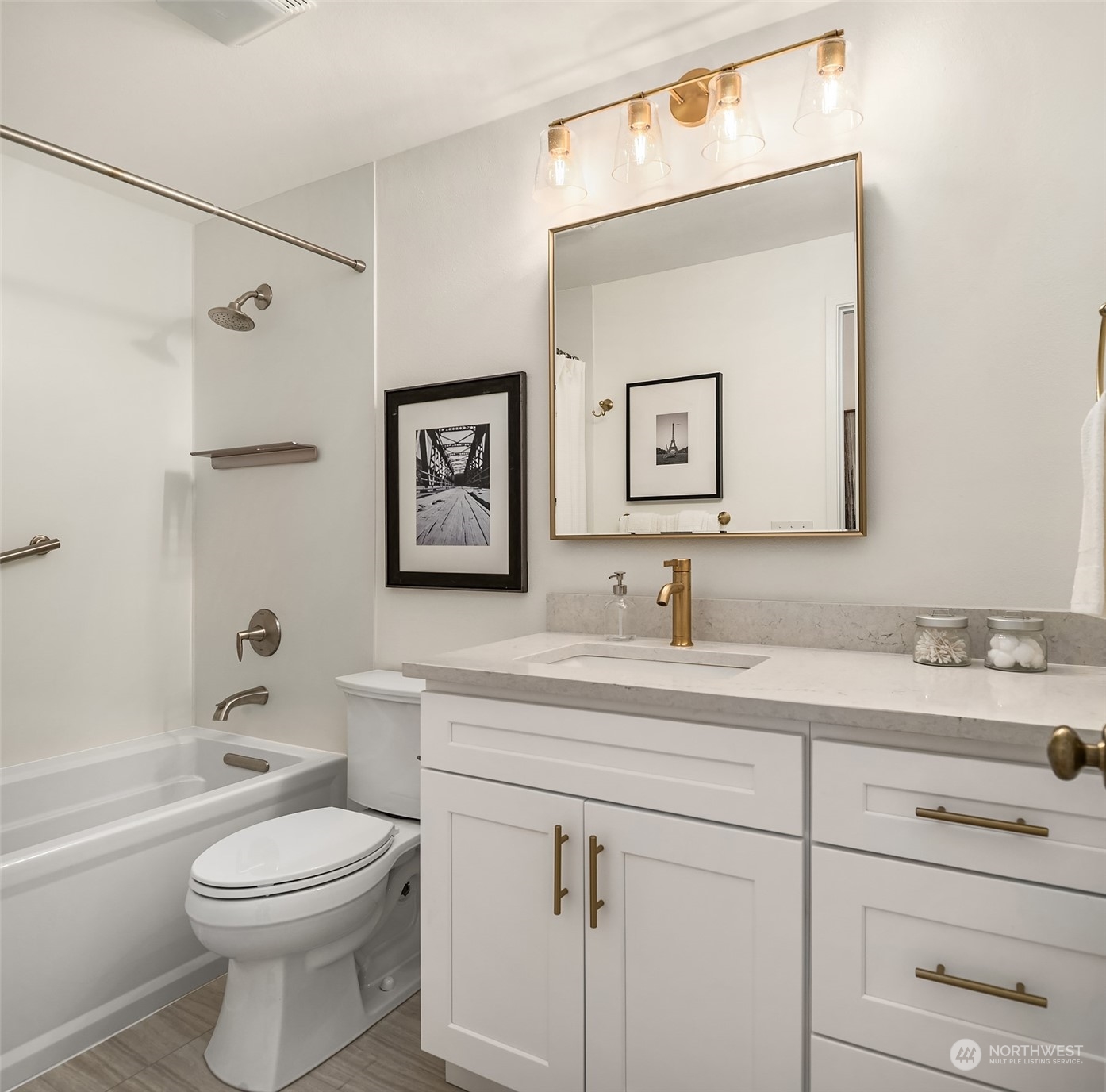 16254 Southeast 144th Street Renton, WA 98059 - Photo 16 of 29 a bathroom with a toilet a sink a mirror and a bathtub