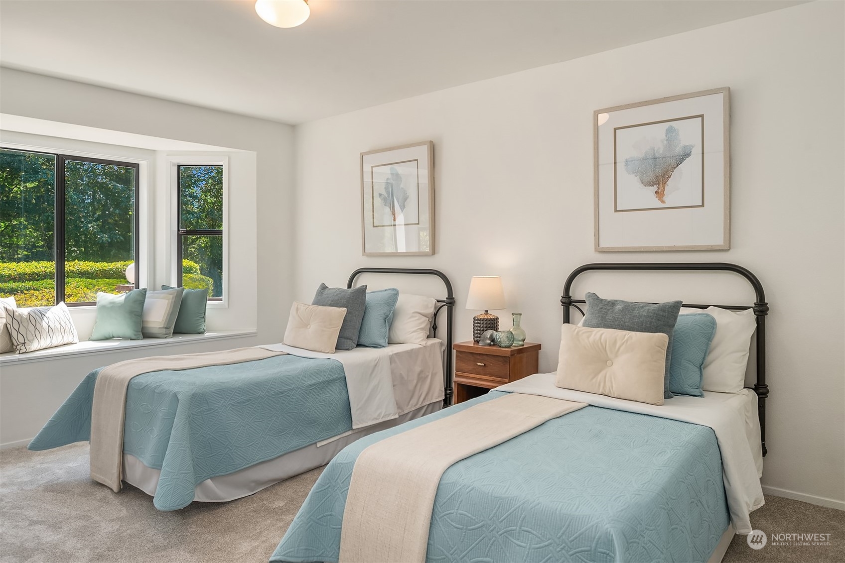 16254 Southeast 144th Street Renton, WA 98059 - Photo 17 of 29 a bedroom with two large bed and a large window