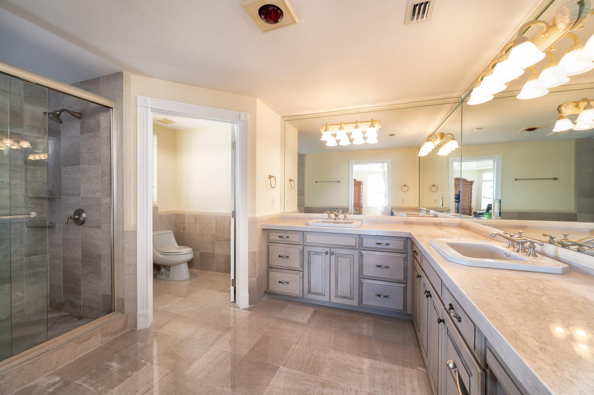 2480 Coco Plum Drive Marathon, FL 33050 - Photo 44 of 92 a spacious bathroom with a granite countertop sink mirror and shower