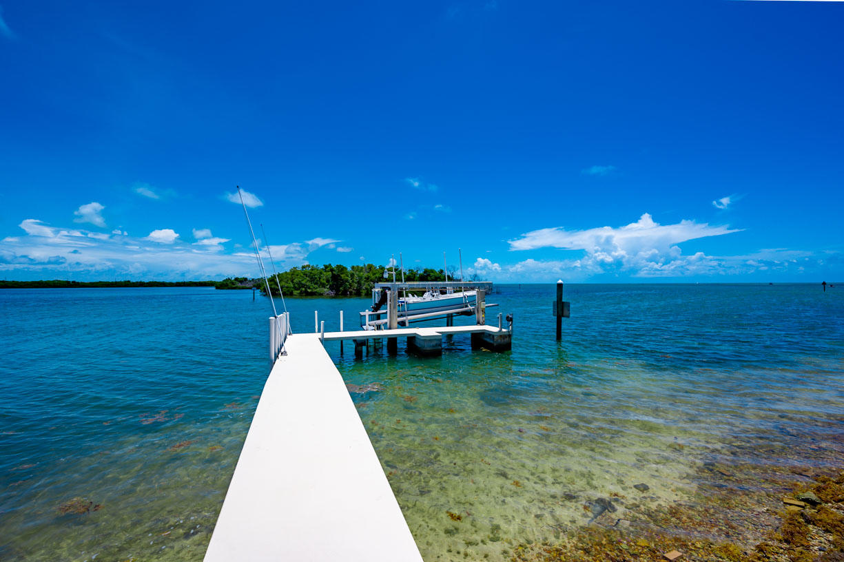 2480 Coco Plum Drive Marathon, FL 33050 - Photo 9 of 92 a view of a lake with a house