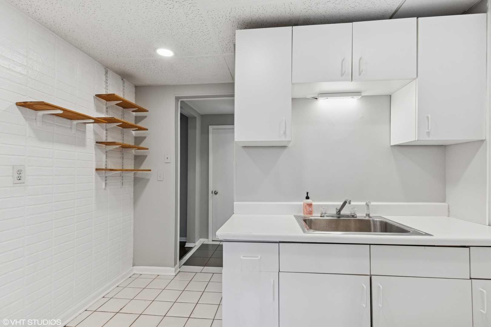 2335 West School Street Chicago, IL 60618 - Photo 9 of 23 a kitchen with a sink cabinets and appliances