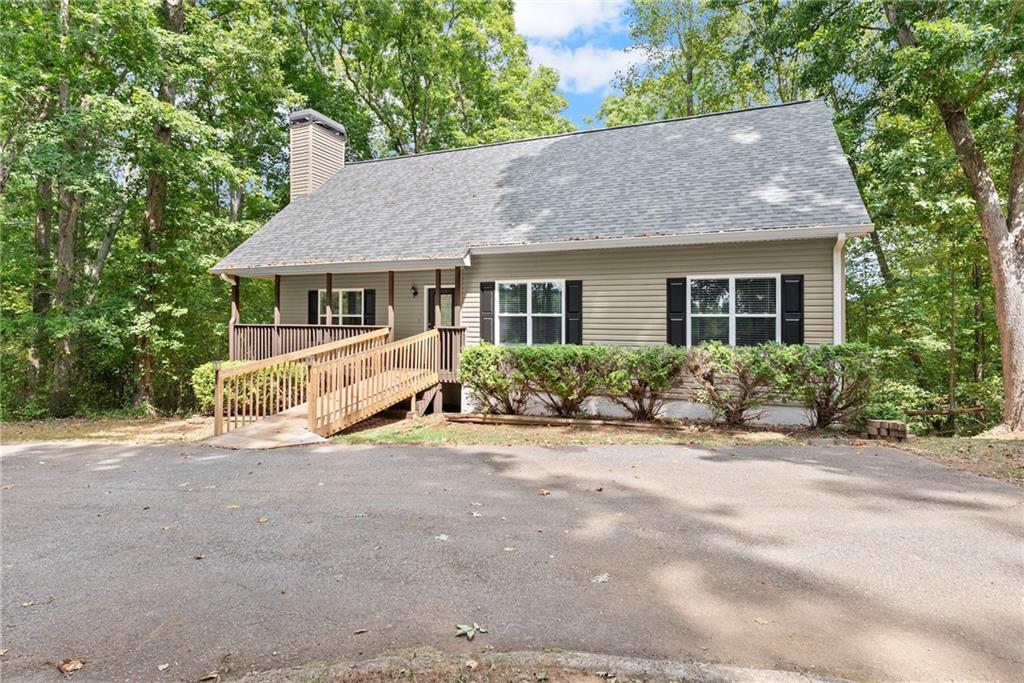 1437 Auraria Road Dahlonega, GA 30533 - Photo 1 of 1 front view of house with a yard