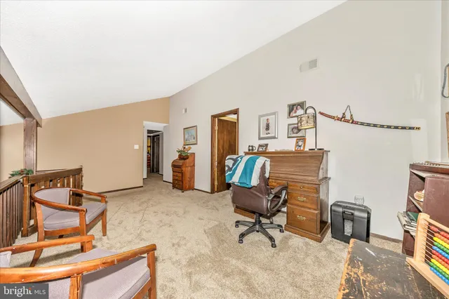 a bedroom with a bed and dresser