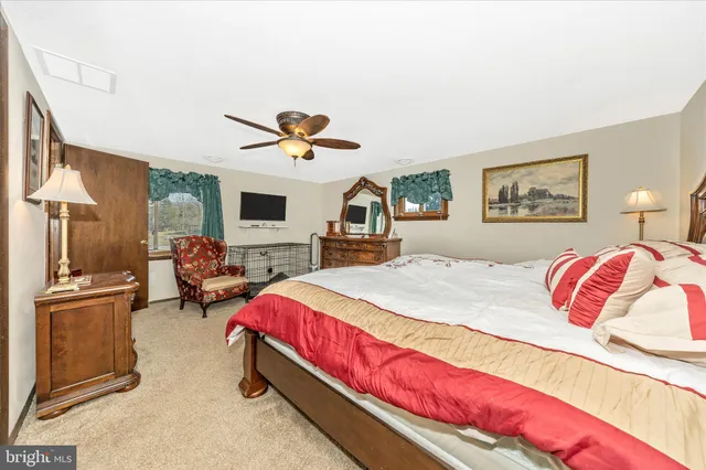 a bathroom with a toilet a sink and a mirror