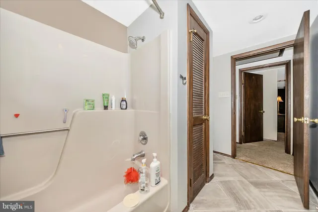a room with furniture and a book shelf