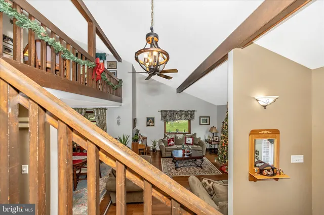 a view of an entryway with wooden floor and stairs