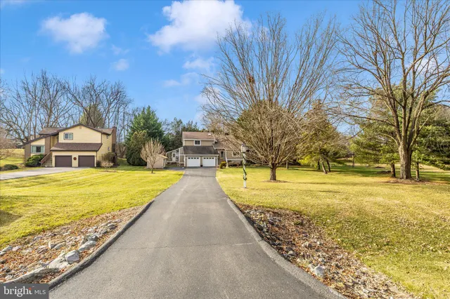 a view of entryway with wooden floor and windows