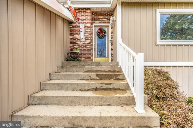 a view of a swimming pool with side of house