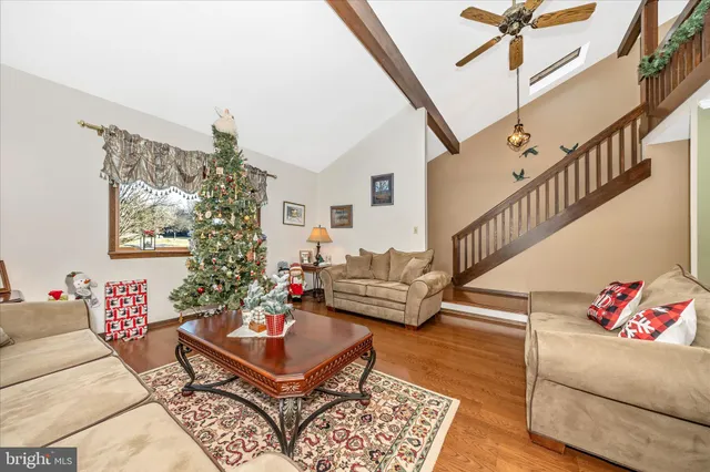a living room with furniture and a rug