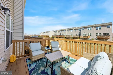 a balcony with wooden benches