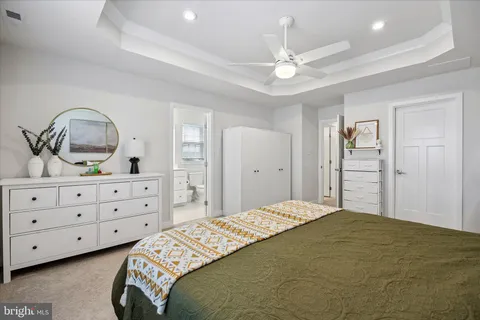 a bedroom with a bed and a dresser