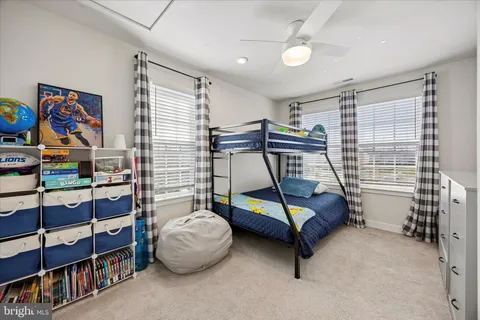 a bedroom with furniture and window