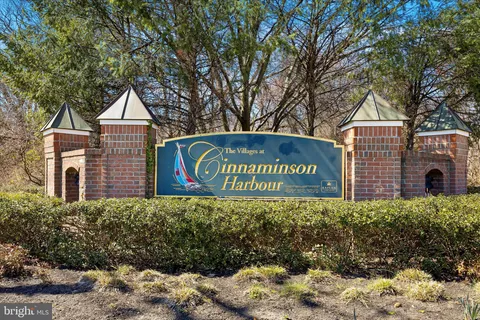 a sign broad in front of the red brick house
