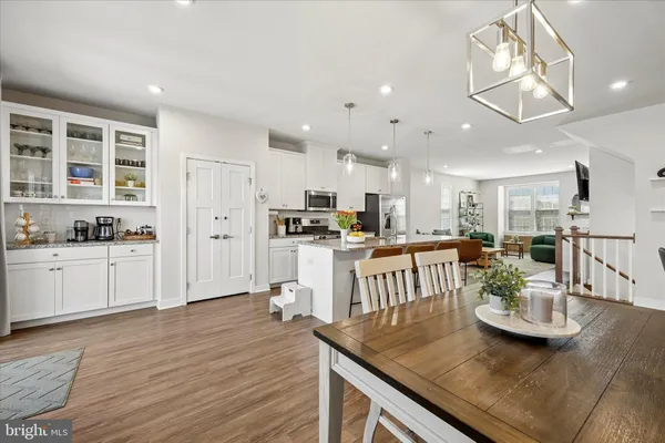 a kitchen with kitchen island granite countertop lots of counter top space and stainless steel appliances