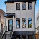 a front view of a house with glass windows