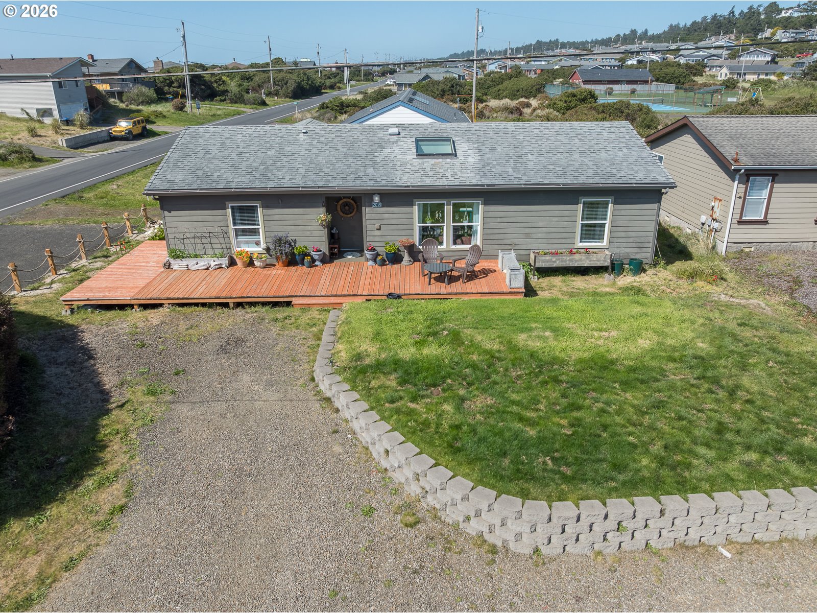 2018 Northwest Oceanic Loop Waldport, OR 97394 - Photo 1 of 35 a front view of a house with a garden
