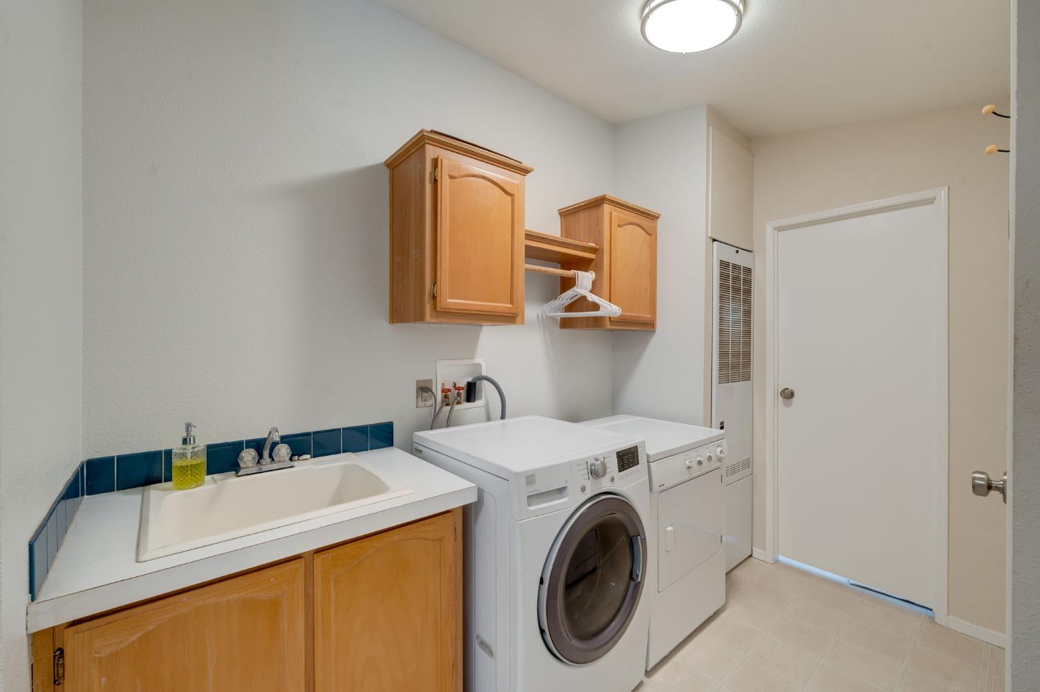 28722 Wood Road Pioneer, CA 95666 - Photo 26 of 39 a utility room with dryer and washer