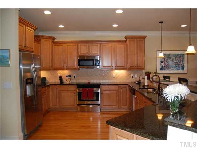 803 Running Brook Trail Raleigh, NC 27609 - Photo 5 of 21 Amazing kitchen complete with ss appliances, granite counters, and lots of counter and cabinet space!