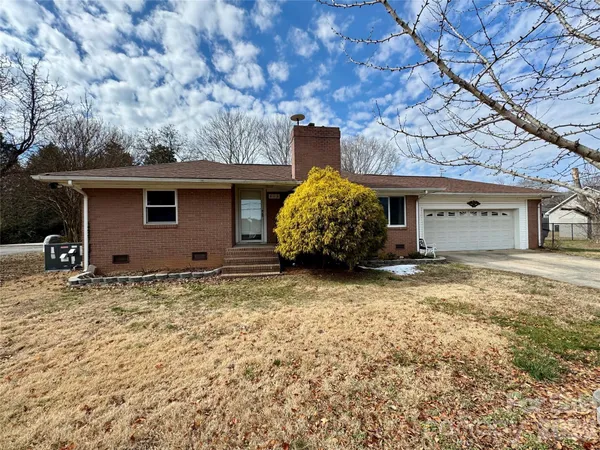 a house with a tree in the background