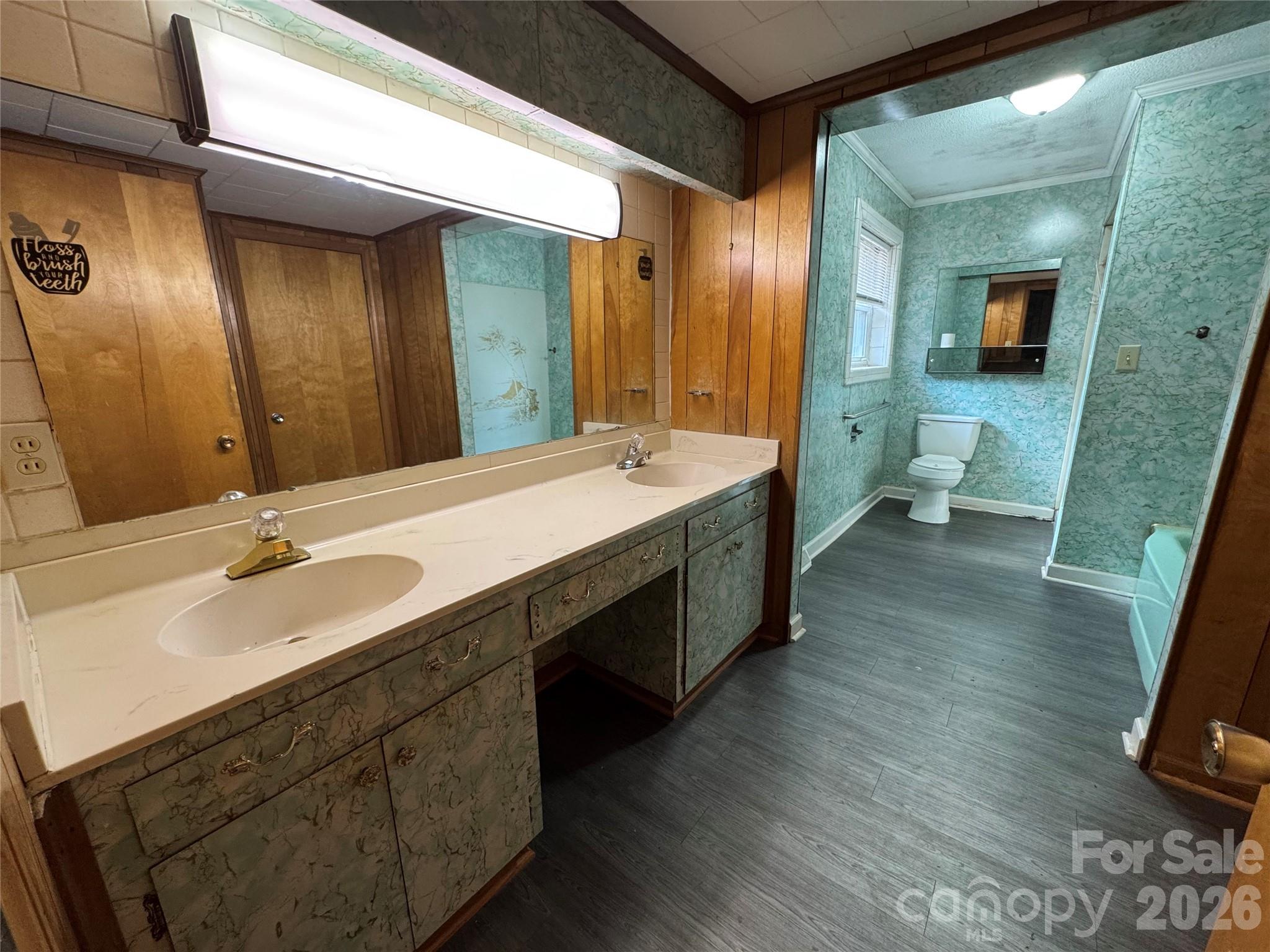 545 Collins Street Kannapolis, NC 28083 - Photo 12 of 27 a spacious bathroom with a double vanity sink and a mirror