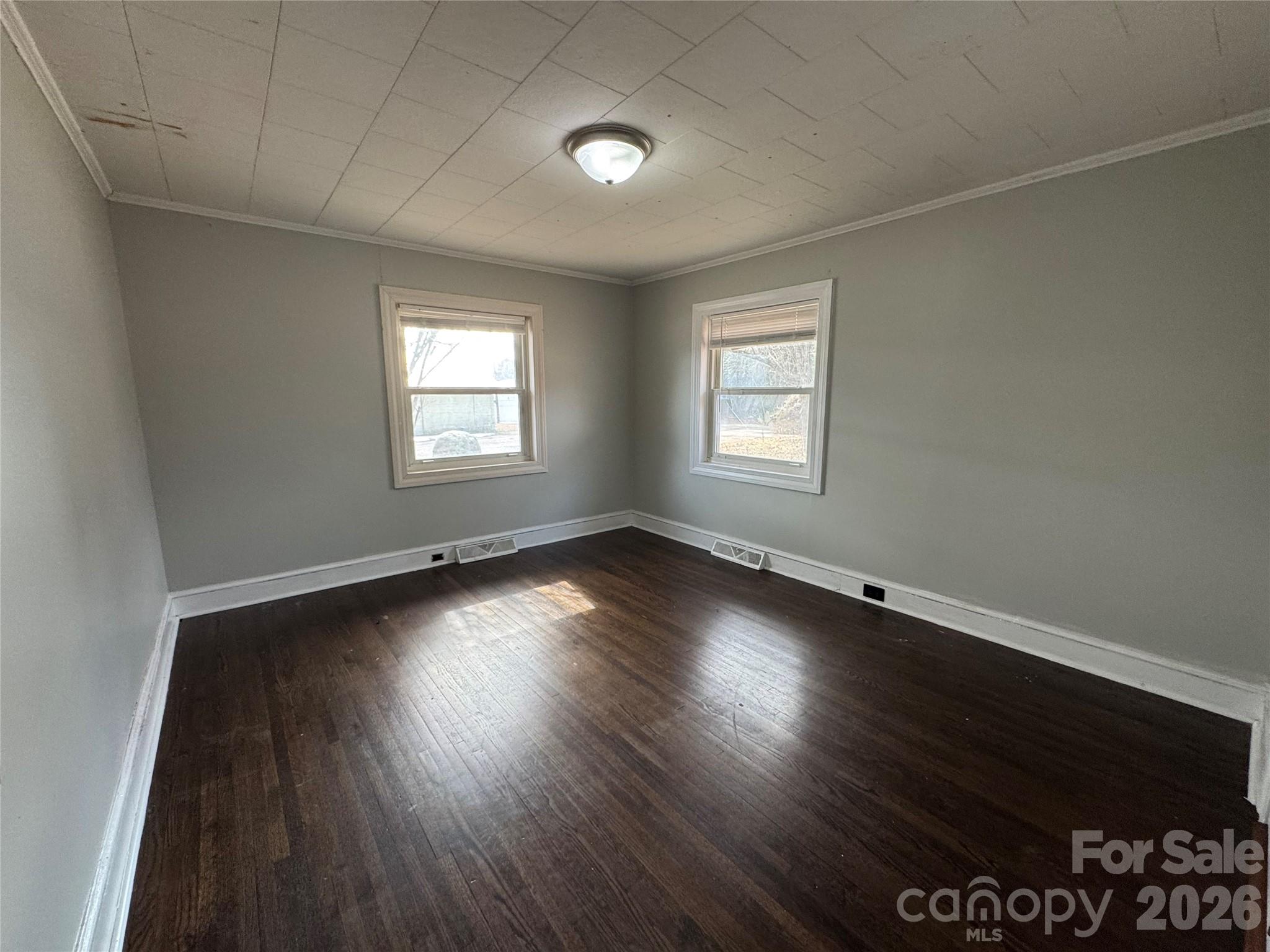545 Collins Street Kannapolis, NC 28083 - Photo 16 of 27 an empty room with wooden floor and windows