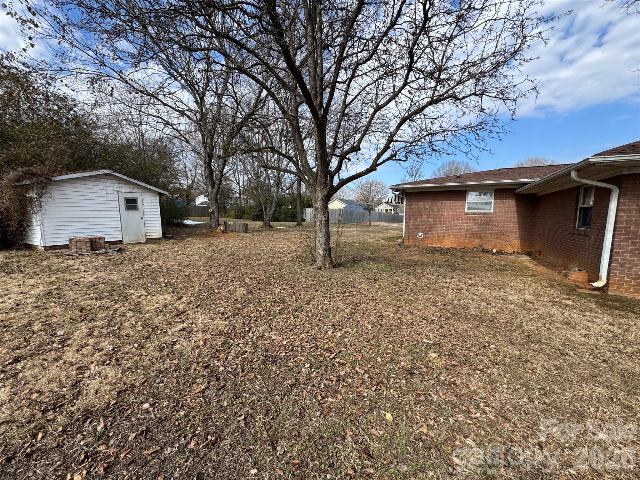 545 Collins Street Kannapolis, NC 28083 - Photo 20 of 27 a house with a tree in front of it