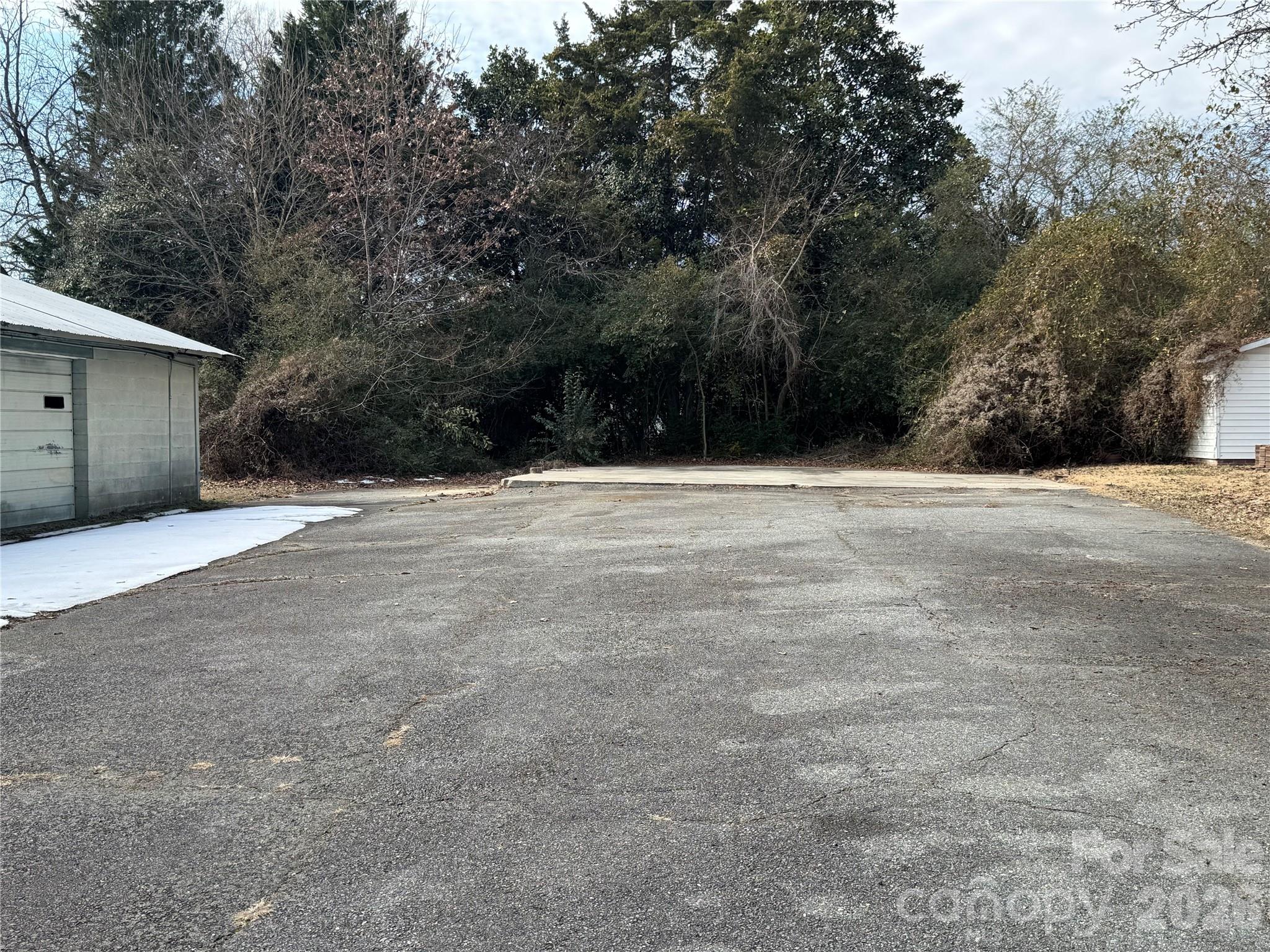 545 Collins Street Kannapolis, NC 28083 - Photo 27 of 27 a view of an empty room with a tree