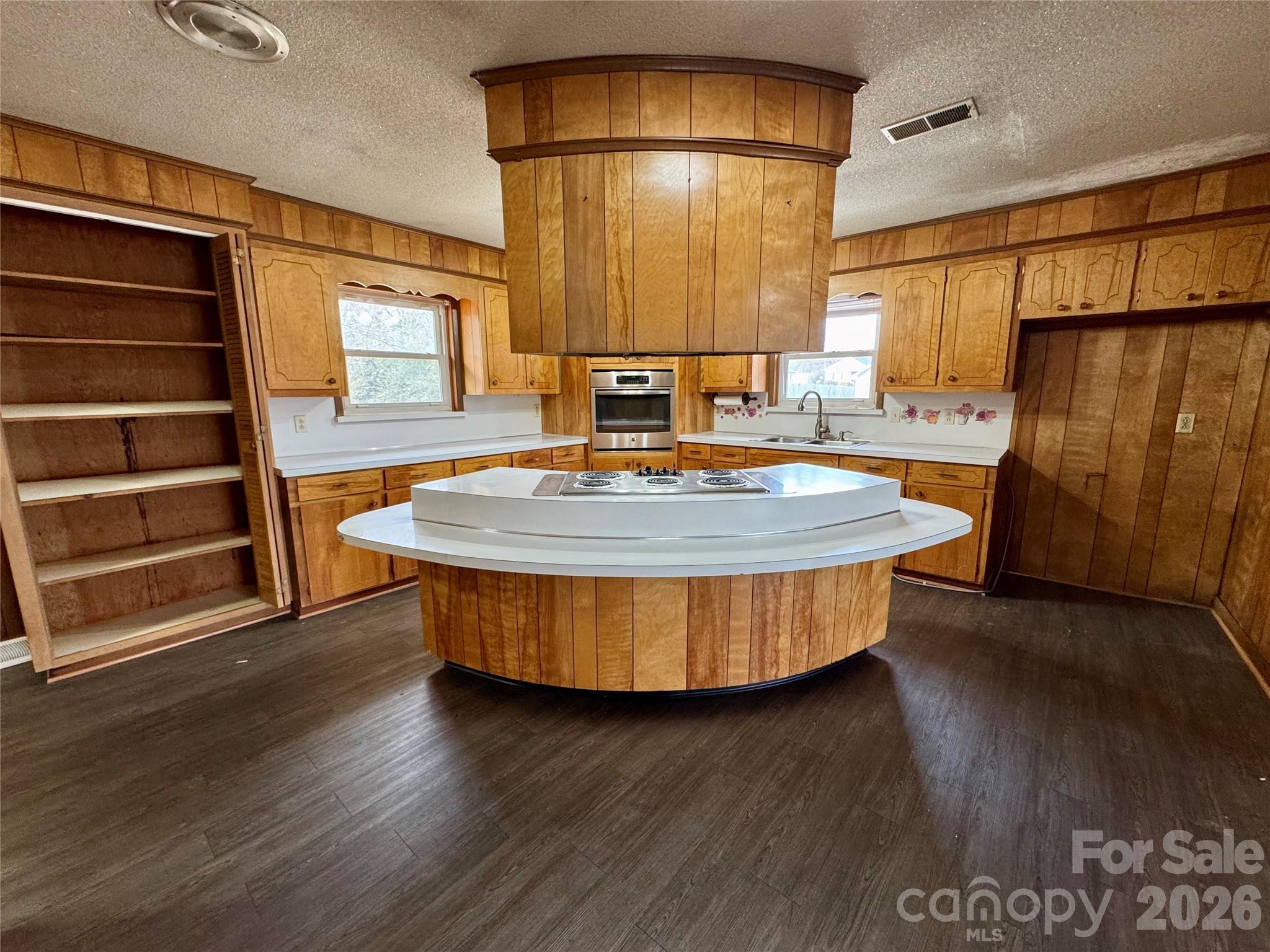 545 Collins Street Kannapolis, NC 28083 - Photo 7 of 27 a view of kitchen with furniture and wooden floor