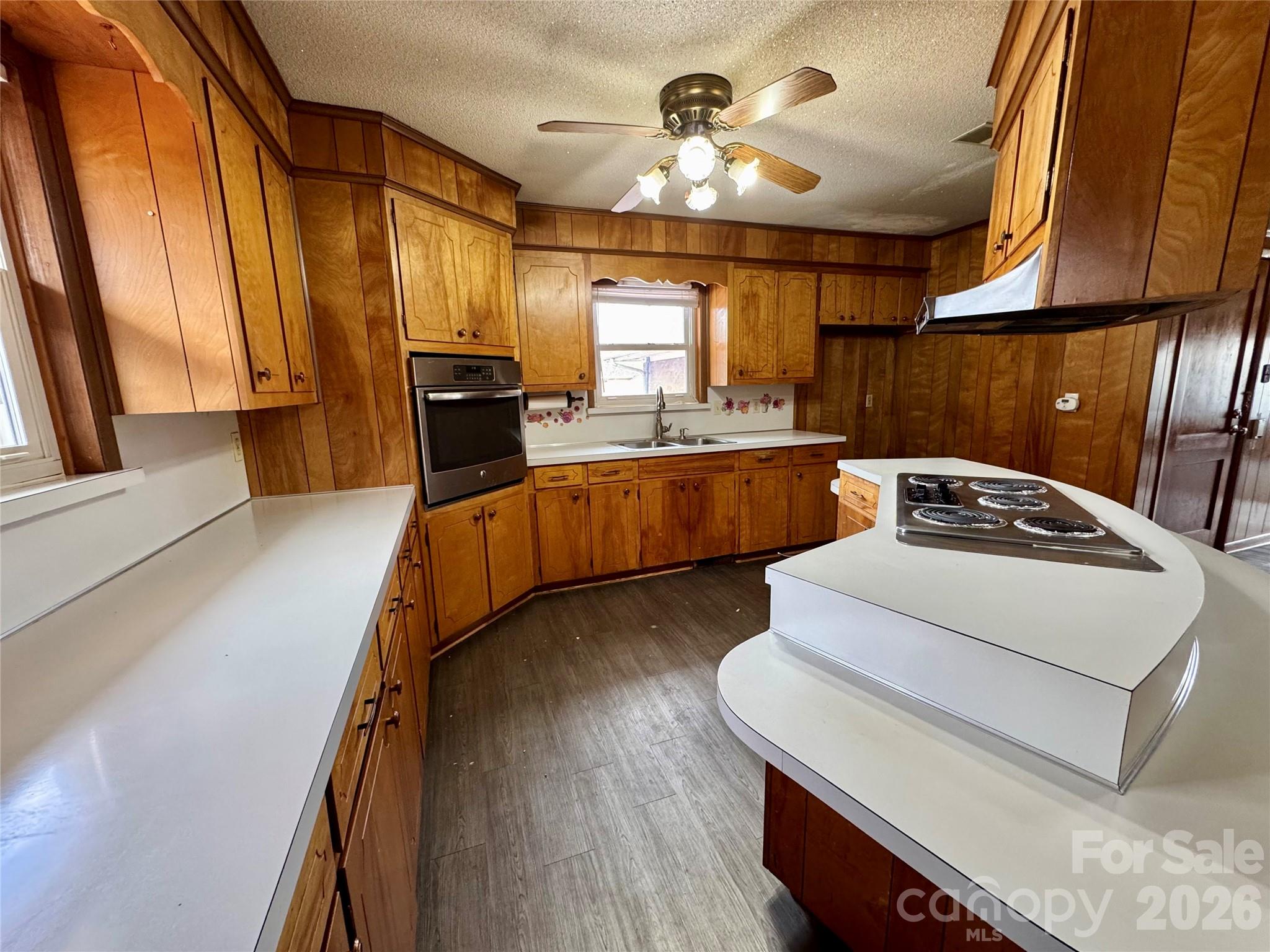 545 Collins Street Kannapolis, NC 28083 - Photo 8 of 27 a kitchen with sink a stove and refrigerator