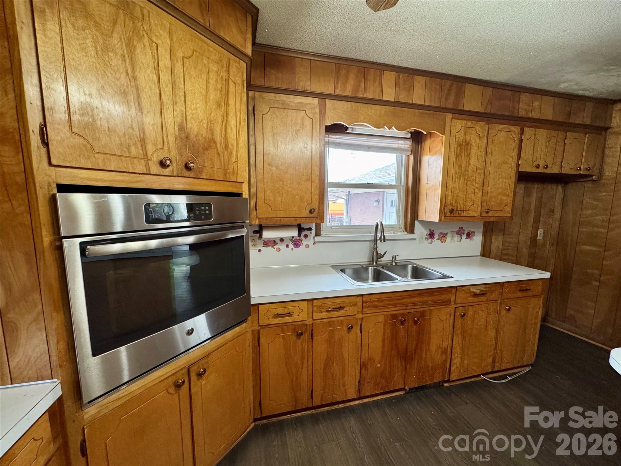 545 Collins Street Kannapolis, NC 28083 - Photo 10 of 27 a kitchen with stainless steel appliances granite countertop a sink a stove and a refrigerator