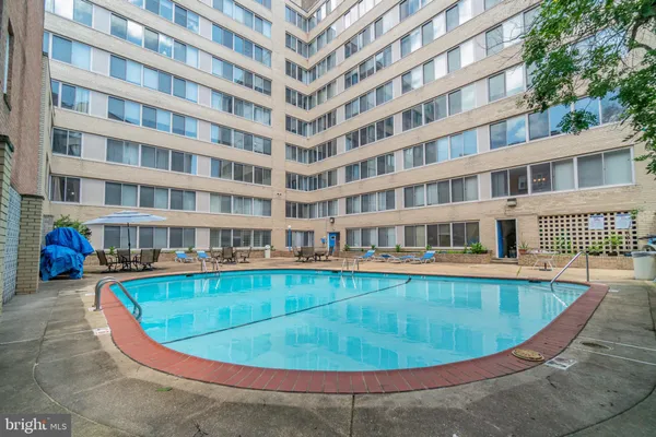 a view of a swimming pool with a lounge chairs