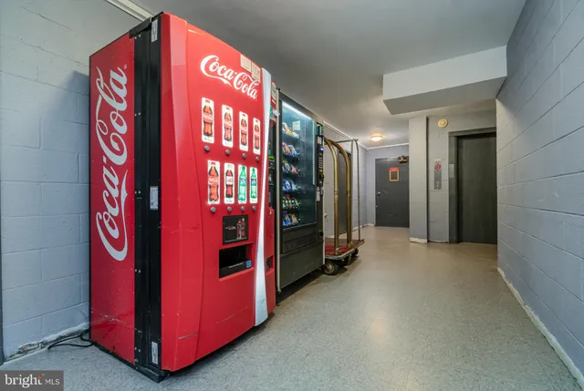 a view of building with yard and swimming pool