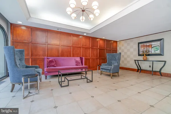 a living room with furniture and a rug