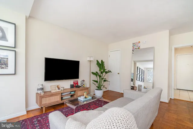 a picture of a bench in front of a wall